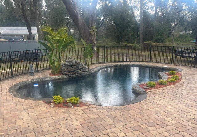 view of swimming pool featuring a patio area