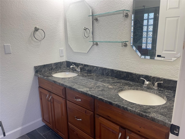 bathroom featuring tile patterned flooring and vanity