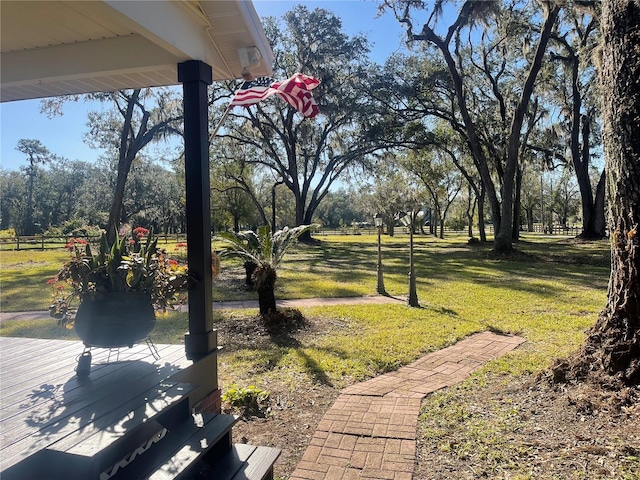 view of property's community with a yard and a deck