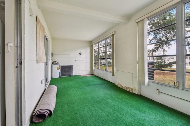 unfurnished sunroom featuring beamed ceiling