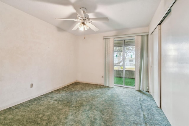 unfurnished room featuring ceiling fan and carpet floors