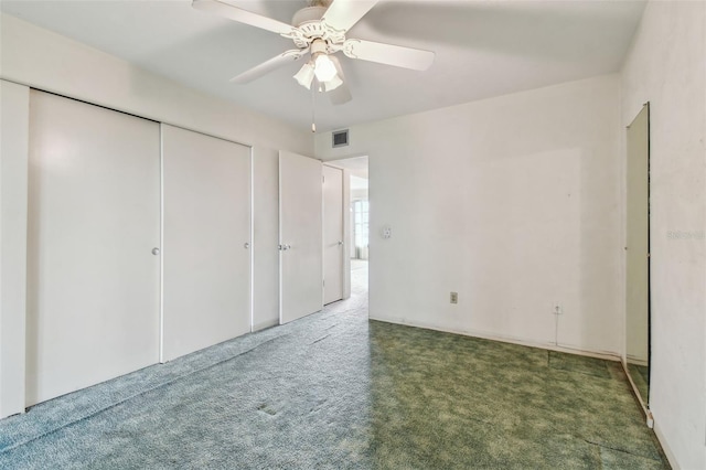 unfurnished bedroom with carpet floors, a closet, and ceiling fan