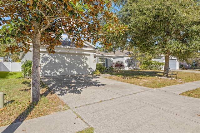 view of front facade featuring a garage and a front yard