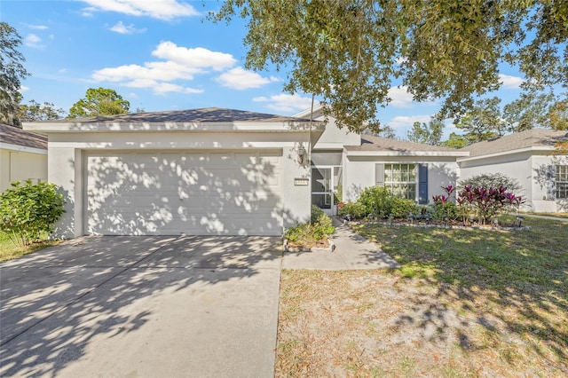 single story home with a garage and a front yard