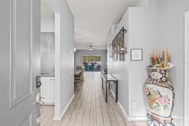 corridor featuring light hardwood / wood-style floors