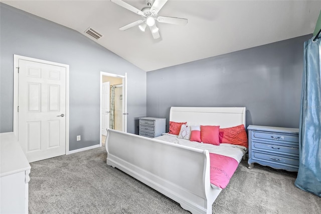 bedroom with carpet flooring, vaulted ceiling, and ceiling fan