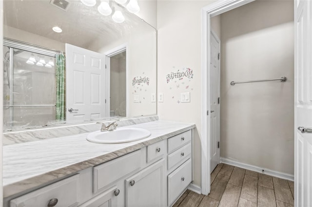 bathroom featuring wood-type flooring and vanity