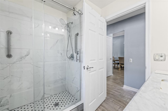 bathroom featuring vanity and tiled shower