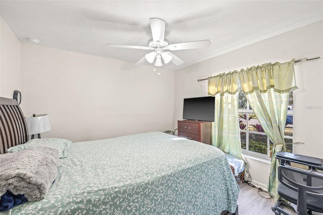 bedroom featuring light wood-type flooring and ceiling fan