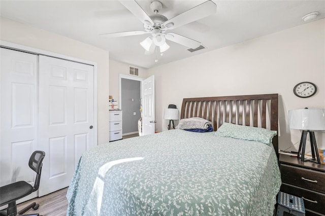 bedroom with ceiling fan, a closet, and light wood-type flooring