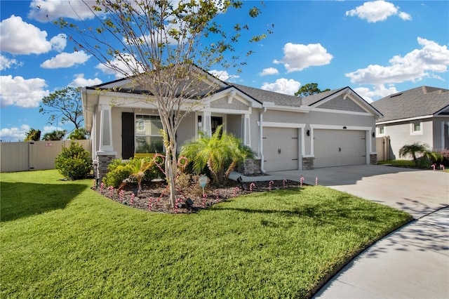 view of front of house featuring a garage and a front lawn