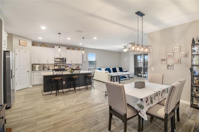 dining area with light hardwood / wood-style flooring