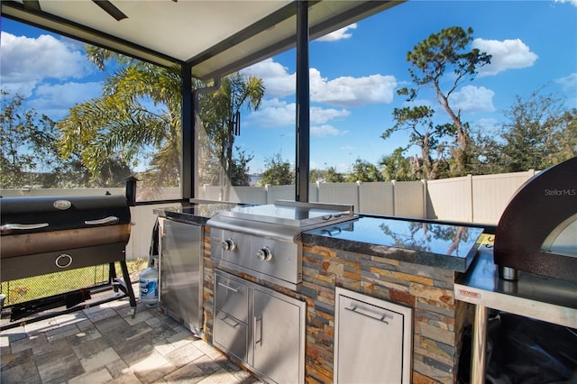 view of patio featuring a grill and exterior kitchen