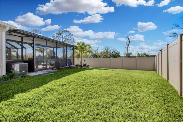 view of yard featuring glass enclosure and cooling unit