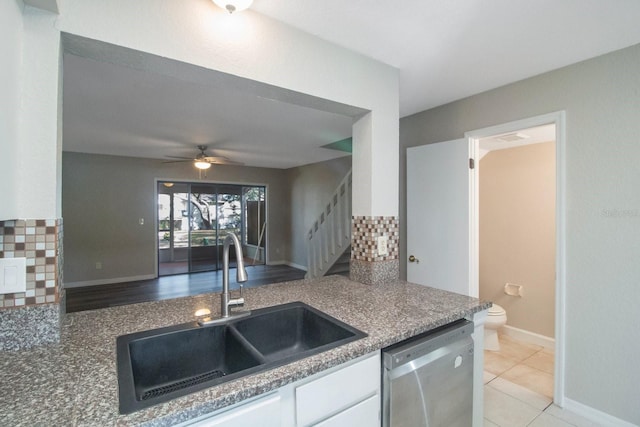 kitchen featuring ceiling fan, dishwasher, sink, tasteful backsplash, and white cabinets