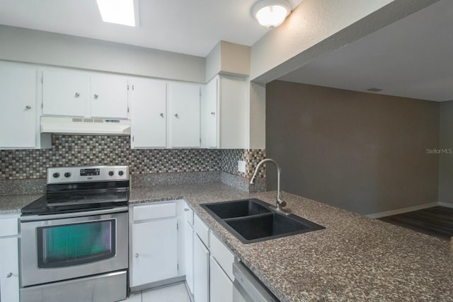 kitchen with stainless steel appliances, white cabinetry, tasteful backsplash, and sink