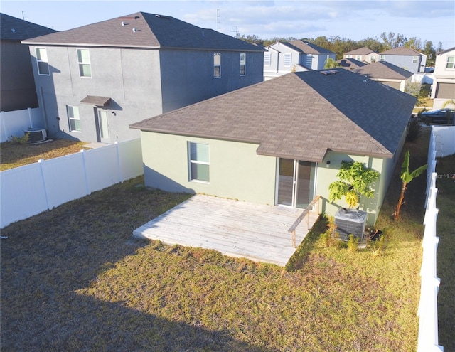 back of house featuring cooling unit