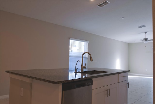 kitchen with dishwasher, a center island with sink, sink, ceiling fan, and white cabinetry