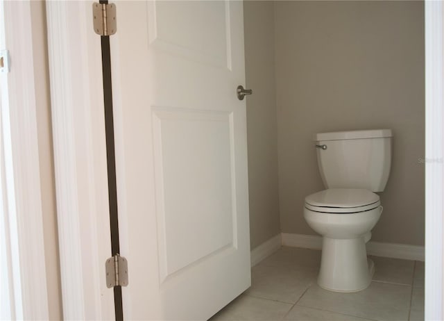 bathroom with tile patterned flooring and toilet