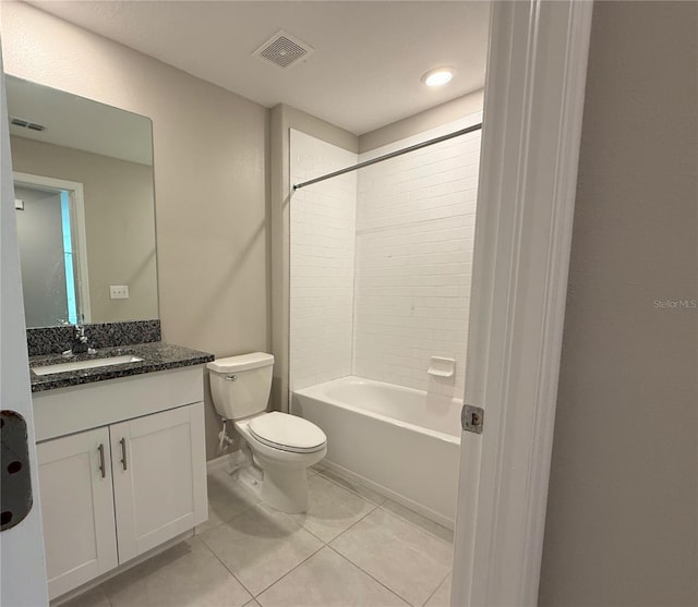 full bathroom with tile patterned flooring, vanity, toilet, and tiled shower / bath combo