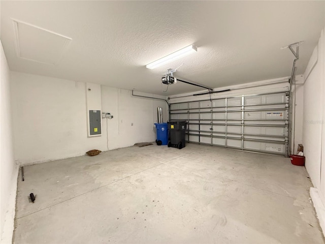 garage featuring electric panel and a garage door opener