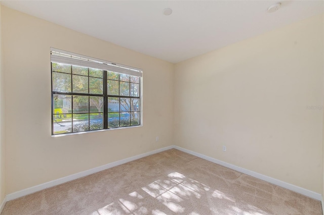 empty room featuring light colored carpet