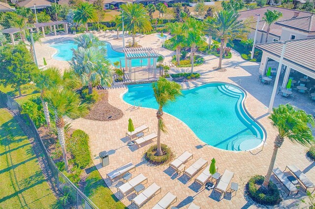 view of swimming pool featuring a pergola and a patio