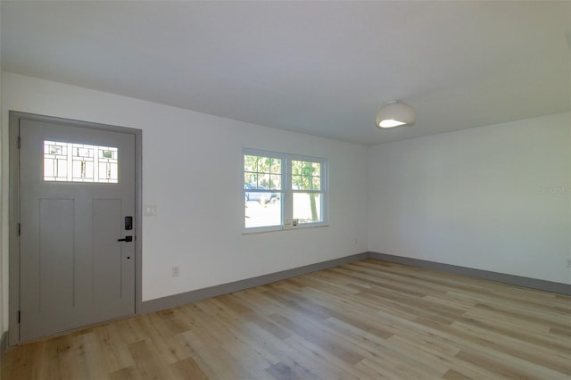 foyer with plenty of natural light and light hardwood / wood-style flooring