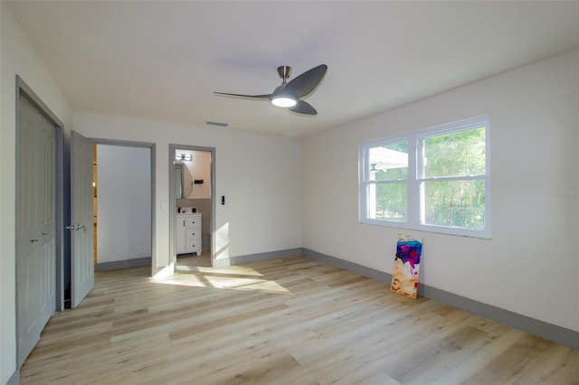 unfurnished bedroom with ceiling fan and light hardwood / wood-style flooring