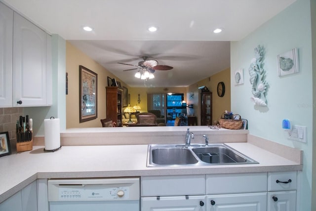 kitchen featuring backsplash, white cabinetry, sink, and white dishwasher