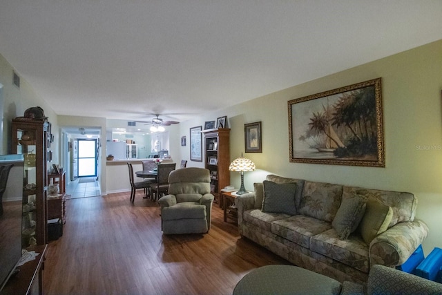 living room featuring hardwood / wood-style flooring and ceiling fan