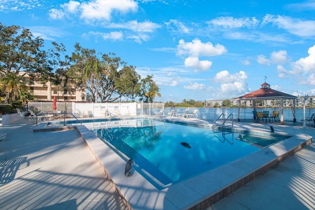 view of swimming pool with a gazebo and a patio area