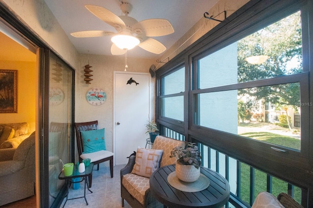 sunroom featuring ceiling fan