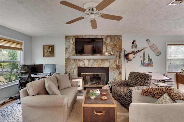 living room featuring a textured ceiling and a wealth of natural light