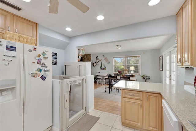 kitchen featuring ceiling fan, light brown cabinetry, white appliances, and light wood-type flooring