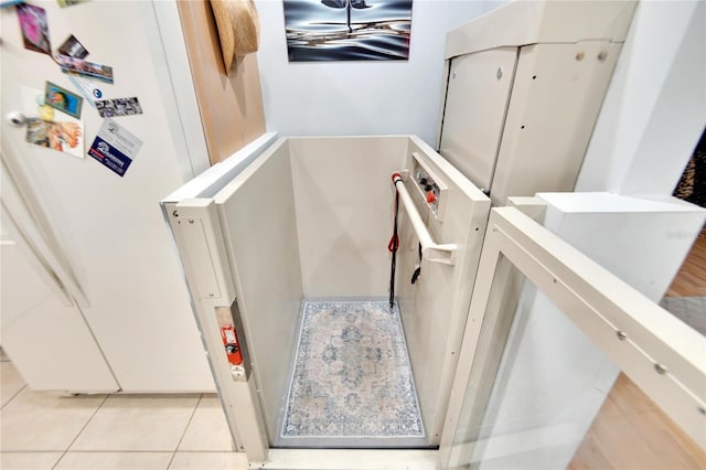 stairway featuring tile patterned flooring