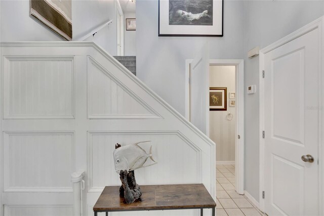 entryway with light tile patterned floors