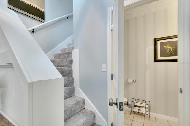 staircase featuring tile patterned flooring