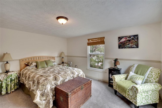 carpeted bedroom with a textured ceiling