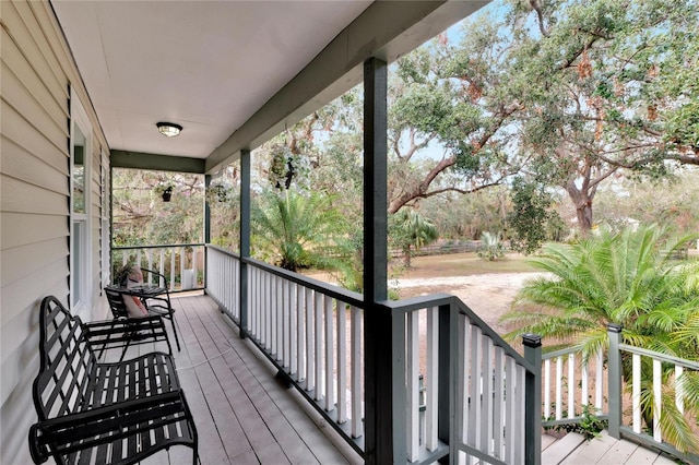 wooden terrace featuring a porch