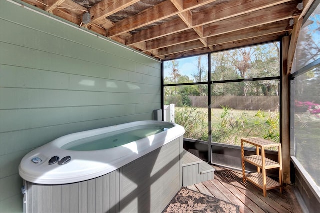 sunroom / solarium with a jacuzzi