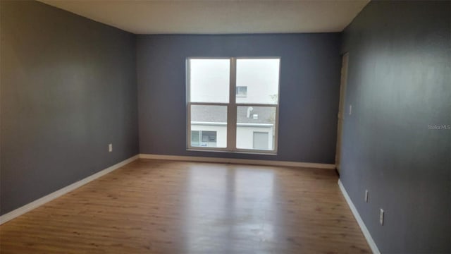 empty room featuring hardwood / wood-style flooring