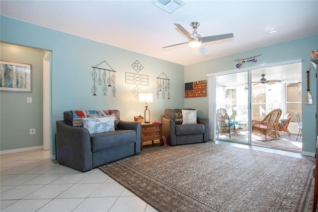 tiled living room with ceiling fan