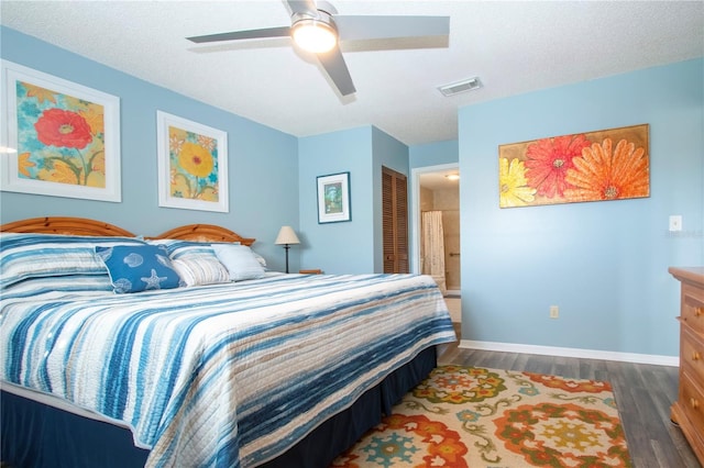 bedroom with dark hardwood / wood-style floors, ceiling fan, a textured ceiling, and a closet