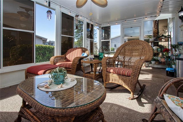 sunroom with a wealth of natural light and ceiling fan