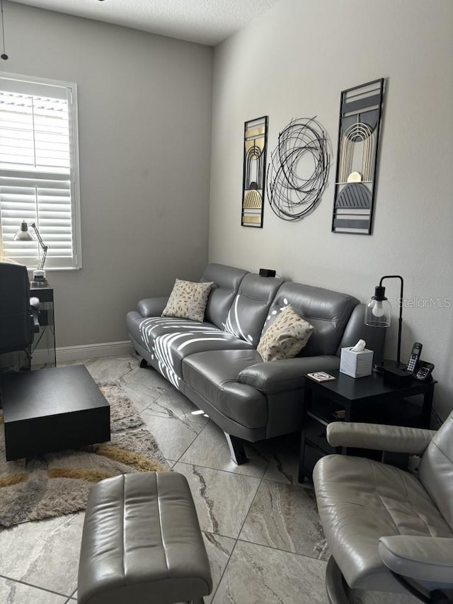 living room with a textured ceiling