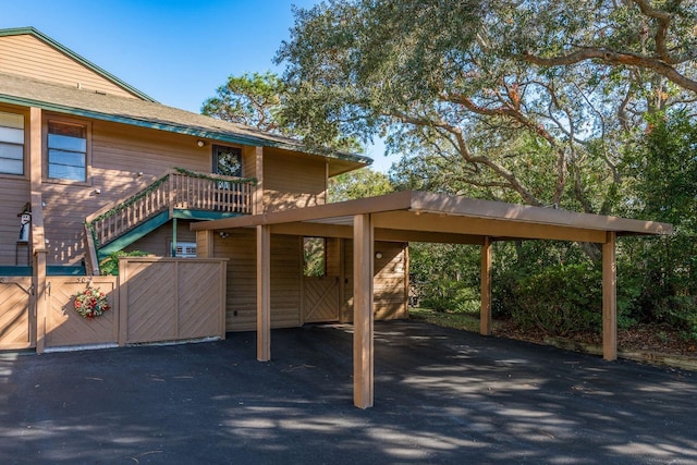 exterior space with a carport