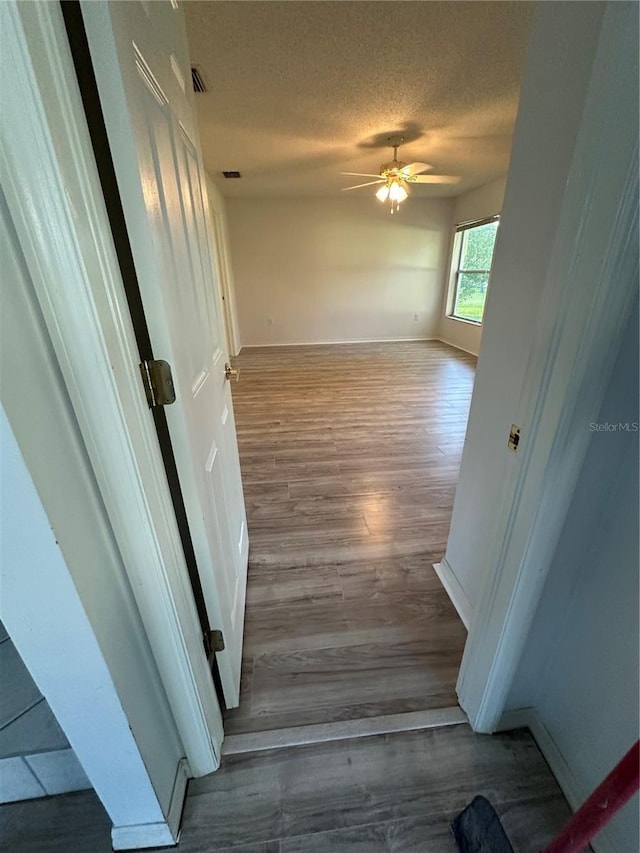 interior space featuring hardwood / wood-style floors and a textured ceiling