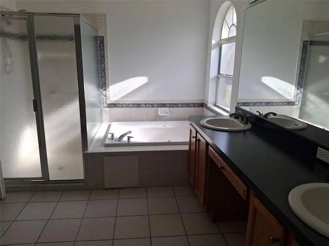 bathroom featuring separate shower and tub, tile patterned flooring, and vanity