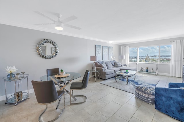 living room featuring ceiling fan, light tile patterned floors, and ornamental molding